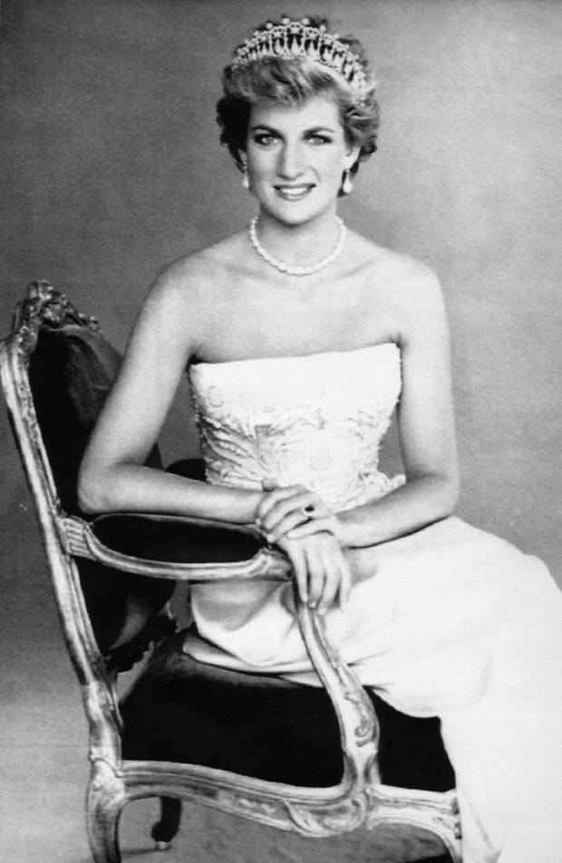 Princess Diana sits regally in an armchair for the new official portrait by photographer Patrick Demarchelier issued by Buckingham Palace Saturday. The Princess of Wales wears a pearl-drop tiara which once belonged to Queen Mary and a strand of pearls.