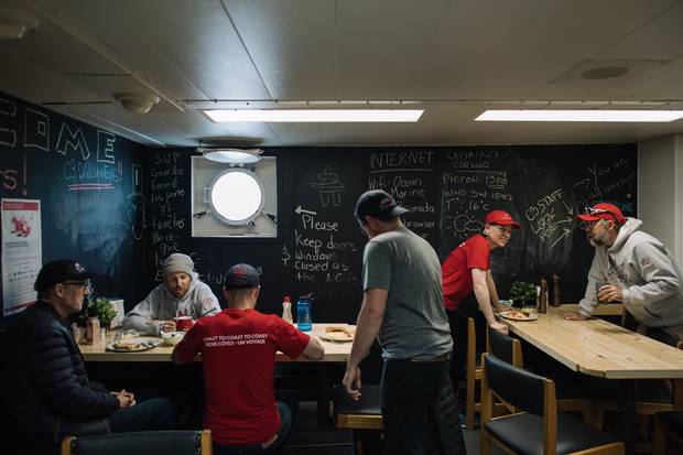Canada C3’s crew gather for breakfast in the dinning area.