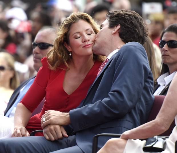 Justin Trudeau gives his wife a kiss during Canada Day festivities on Parliament Hill in 2016.