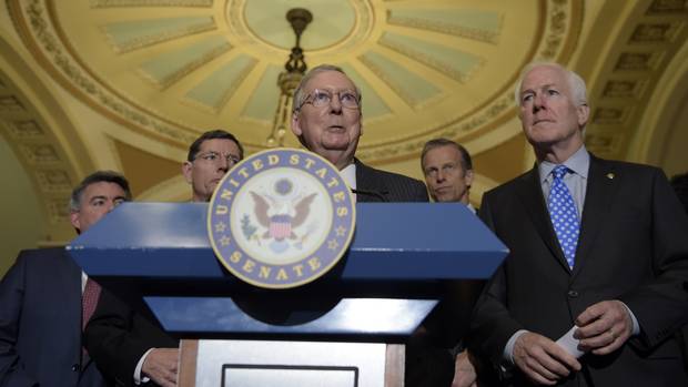 Senate Majority Leader Mitch McConnell, middle, speaks to reporters alongside other Republican senators on Capitol Hill on Feb. 7, 2017.