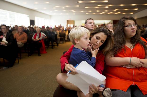 2013: Chrystia Freeland, who is running for the Liberal Party nomination in the by-election to replace Bob Rae as the MP for Toronto Centre, holds her son Ivan Bowley, 4, as she reviews her notes before making a speech ahead of the vote in Toronto on Sunday, September 15, 2013.