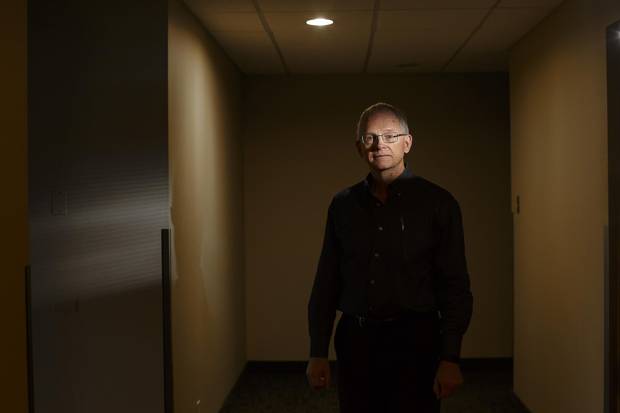 Larry Kelly, seen at the former Venture Publishing offices in Edmonton on Friday, was shocked and devastated when his wife died by suicide in June.