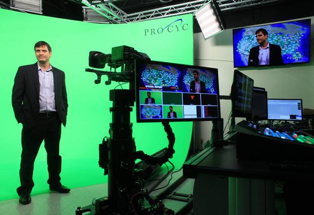 Mr. Ross of Ross Video poses with a robotic camera.