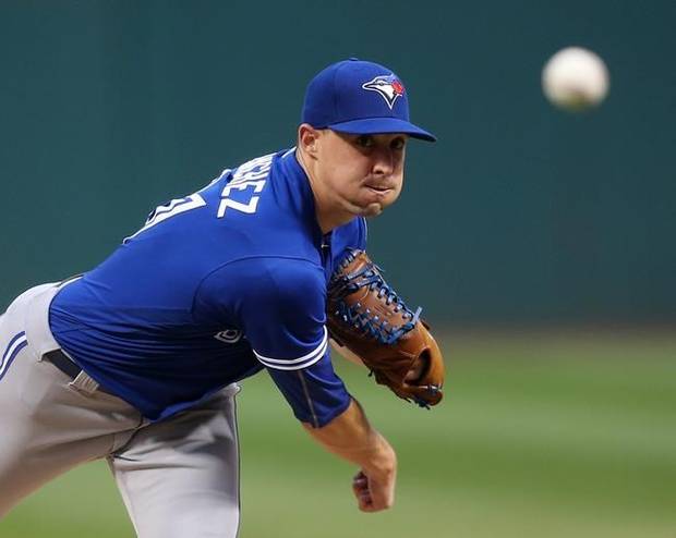 Toronto Blue Jays starting pitcher Aaron Sanchez throws during the first inning of a baseball game against the Cleveland Indians, Saturday, Aug. 20, 2016, in Cleveland. (AP Photo/Aaron Josefczyk)