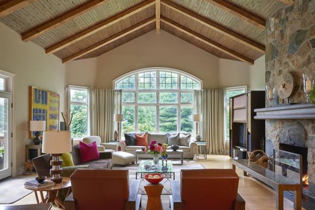 The Rhode Island fieldstone used for the exterior of the house is also used in the home's fireplaces and to line some of the interior walls.