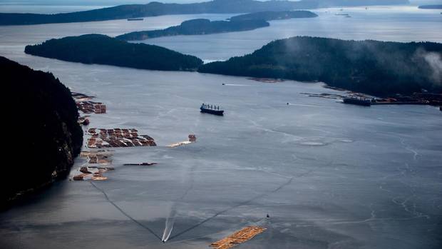 Marine traffic travels on the waters of the Strait of Georgia near Nanaimo, B.C., on Feb. 19, 2014.