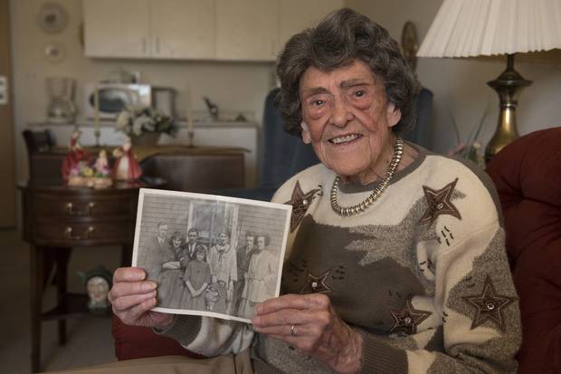 Kaye Chapman, 104, holds a photo of her parents and siblings taken a few years after the Halifax explosion of 1917. She now lives in Saint John.