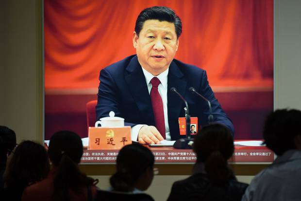 A portrait of Chinese President Xi Jinping is displayed at an exhibition showcasing China's progress in the past five years at the Beijing Exhibition Center.