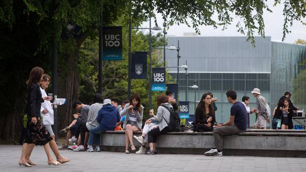 People walk on the Main Mall at the University of British Columbia campus in Vancouver, B.C., on Thursday August 20, 2015.