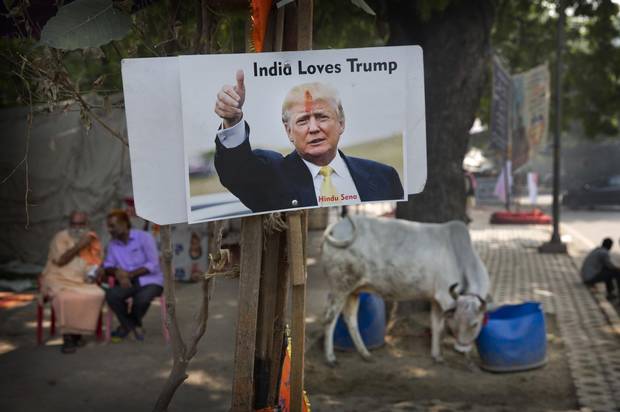 A photograph of Mr. Trump is displayed by activists belonging to ‘Hindu Sena,’ or Hindu Army, a local organization in India, in New Delhi on Nov. 9, 2016.
