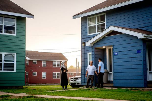 Mr. Sharbaji and Sedra speak with his friend Mahmoud Moussa Basha, who is also from Aleppo. The two met on a plane to Toronto from Egypt and have been friends ever since.