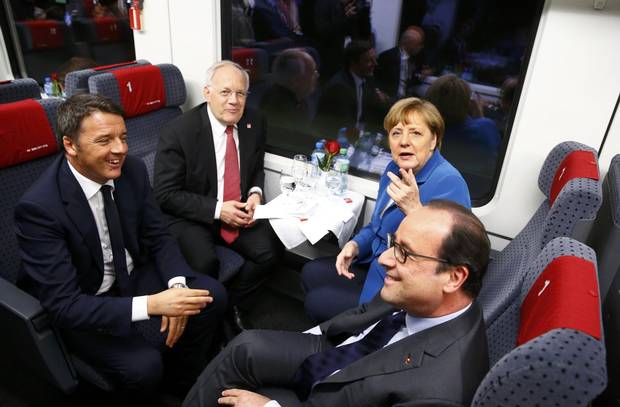Italian Prime Minister Matteo Renzi, Swiss Federal President Johann Schneider-Ammann, French President François Hollande and German Chancellor Angela Merkel travel in the VIP train during the opening ceremony.