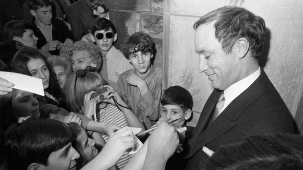 Pierre Trudeau signs autographs for crowd of admirers in Ottawa on April 20, 1968, the day of his swearing in as prime minister of Canada. Mr. Trudeau, who replaced prime minister Lester Pearson after his resignation, ran in a general election two months later and won a majority government.