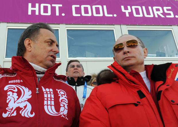 Russia's Minister of Sport Vitaly Mutko, left, with President Vladimir Putin, said the accusations were 'very made up' – but did report the disgraced head of the Moscow lab had been removed.