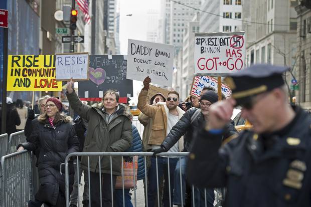 Anti-Trump protesters shout at supporters of US President Donald Trump during a rally near Trump Tower in Fifth Avenue, February 5, 2017 in New York.