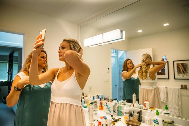 Isabella Hay, a 17-year-old high school student, prepares for her graduation at her home with her mother, Nancy. Isabella has used hypnosis to assist her deal with OCD.