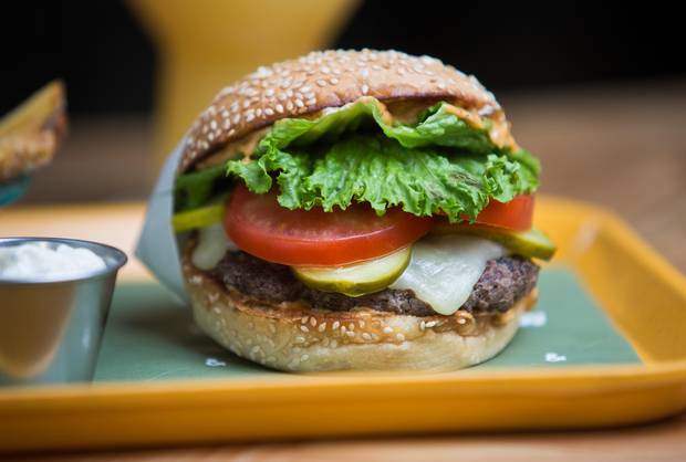 The beef patties are hand-formed from a mixture of short rib, brisket and chuck.