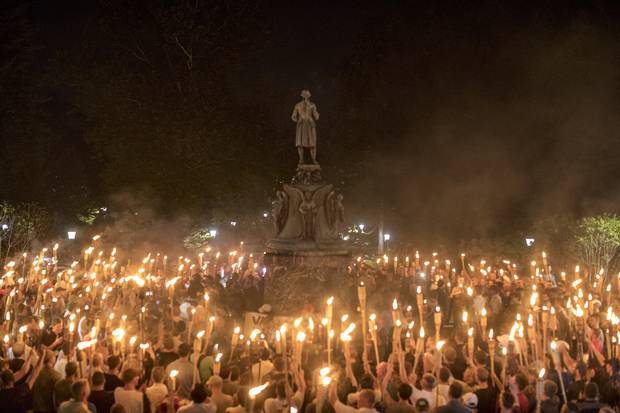Torch-bearing white nationalists rally around a statue of Thomas Jefferson near the University of Virginia campus in Charlottesville, Aug. 11, 2017.