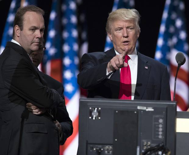 Rick Gates, left, is shown beside Trump on July 21, 2016, as he prepares for his speech at the Republican National Convention in Cleveland.