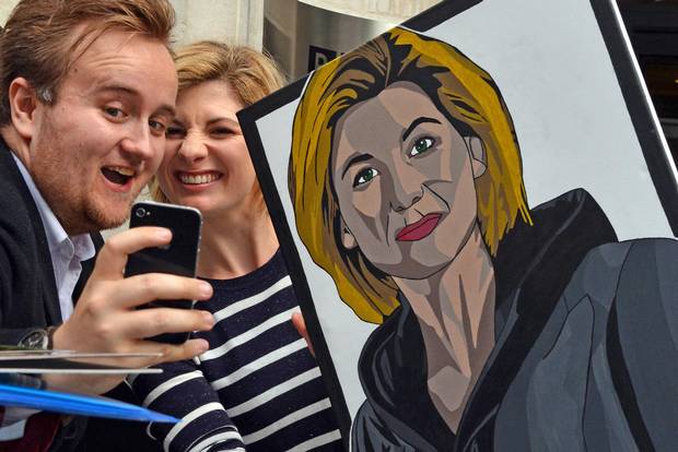 Actress Jodie Whittaker, the first female actor to play Doctor Who, with a portrait of her character in London on Aug. 13, 2017.