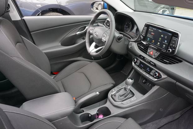 The dashboard flaunts the car's European character.