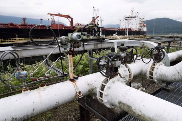 A ship receives its load of oil from the Kinder Morgan Trans Mountain expansion project’s Westeridge loading dock in Burnaby, B.C.