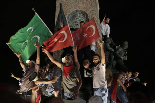 People wave Turkish flags as they gather in Taksim Square in Istanbul, protesting against the attempted coup, Wednesday, July 20, 2016. Turkish President Recep Tayyip Erdogan declared a 3-month state of emergency after a failed coup.