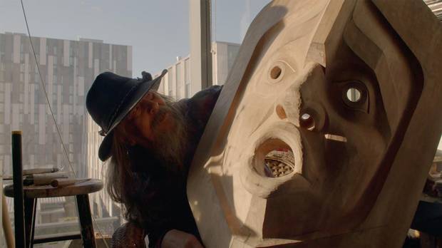 Beau Dick in his studio at the University of British Columbia, showing the progress on his final Wind Mask. It was completed shortly before his death. 