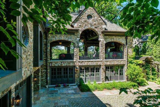 The 930-square-foot loggia sits above the pool and functions as an outdoor living room and kitchen.