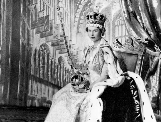 Queen Elizabeth II is shown in Buckingham Palace’s Throne Room after her coronation on June 2, 1953.