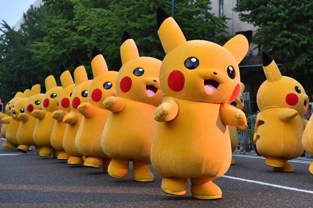 (FILES) This file picture taken on August 2, 2015 shows costumed performers dressed as Pikachu, the popular animation Pokemon series character, attending a promotional event at the Yokohama Dance Parade in Yokohama. 