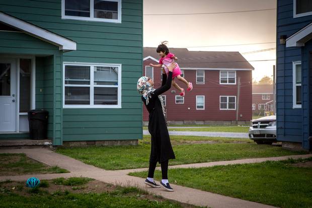 Sedra plays with the daughter of Mahmoud Moussa Basha. Mr. Sharbaji said his children fill part of the void left in his heart when he had to leave his grandchildren.