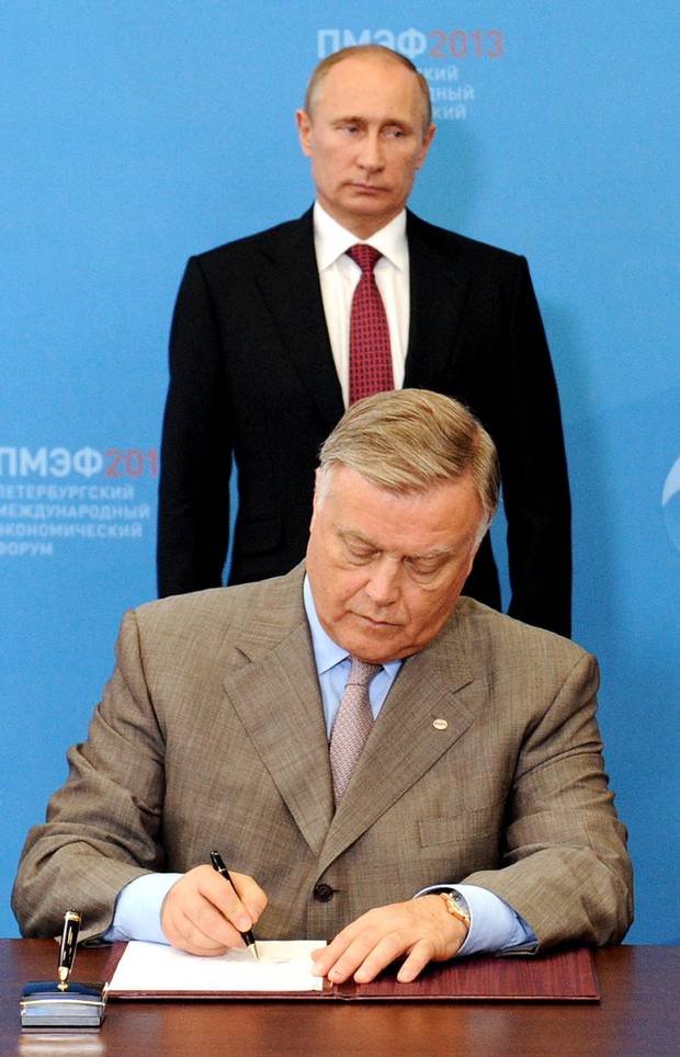 Russia's President Vladimir Putin and then-Russian Railways head Vladimir Yakunin in St. Petersburg, on June 20, 2013.
