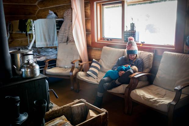 Tessa Treadway breastfeeds her son Raffi at Tweedsmuir Ski Club’s backcountry cabin.