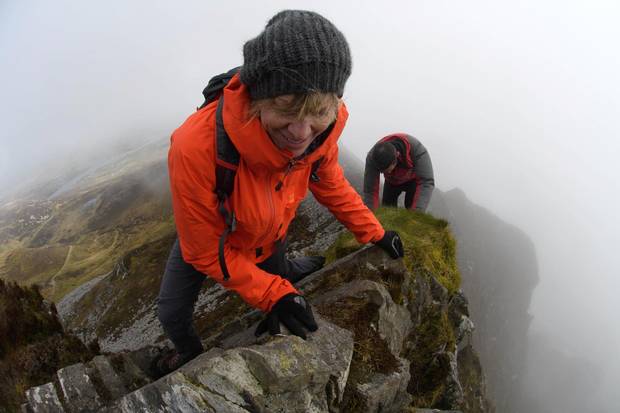 The towering cliffs of Slieve League give climbers a view of the drifting clouds.