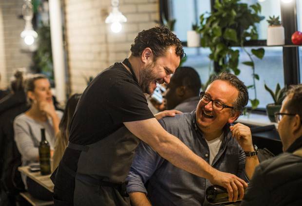 Chef Rob Bragagnolo serves customers at Campo.