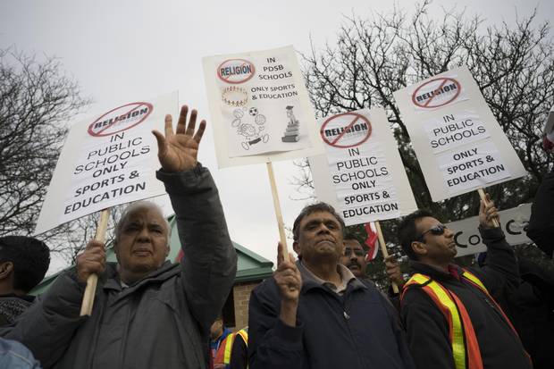 Outside the offices of the Peel District School Board in Mississauga, secular-school advocates, many from South Asian backgrounds, protest religious accommodation in Peel schools last Tuesday.