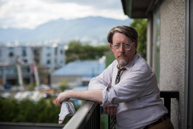 Ian Martin is pictured in his rental apartment in Vancouver. 