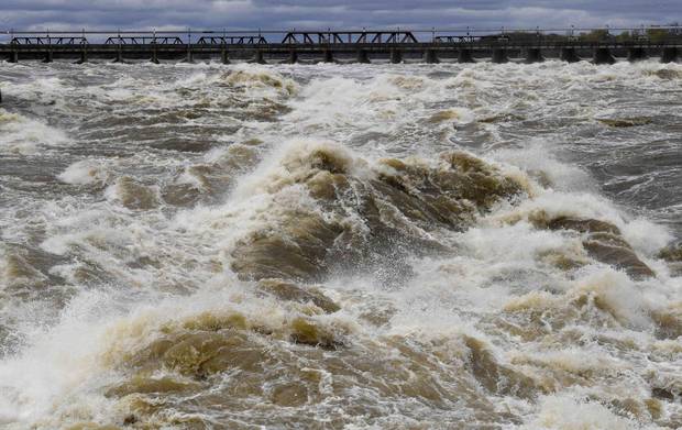 The Ottawa River rages after passing the dam at the Chaudiere Falls in Ottawa, in May, 2017. The St. Lawrence and Ottawa rivers reached levels unseen in millennia.