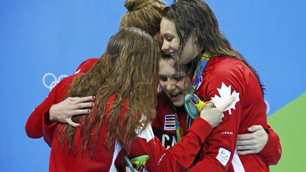 Team Canada Katerine Savard (CAN) of Canada, Taylor Ruck (CAN) of Canada, Brittany MacLean (CAN) of Canada and Penelope Oleksiak (CAN) of Canada pose with their medals.