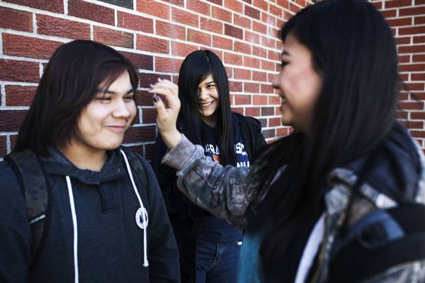 Marleah, middle, hangs out between classes with friends Blake Windego, left, and Titanice Berens-Smith. Titanice, who struggled with a difficult Grade 9 year, says Ms. McMonagle helped get her back on track. Titanice would be the first person in her family to graduate high school, and is determined to make it through. ‘It means I will have a life.’