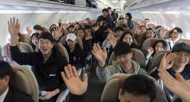 South Korean skiers on a chartered flight wave to the media before taking off to North Korea at Yangyang International Airport in Yangyang, South Korea. Several South Korean skiers headed to North Korea to train with its athletes in a conciliatory gesture the countries planned to mark the Winter Olympics in the South.