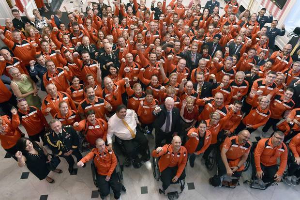Members of Team Canada pose for a photo with the Governor-General, military officials and cabinet ministers at a Rideau Hall welcoming ceremony on Sept. 20.