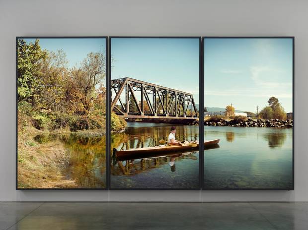 Rodney Graham’s lightbox triptych Paddler, Mouth of the Seymour, 2012-13 serves as a sort of centrepiece for the exhibition and is visible from the VAG’s rotunda.