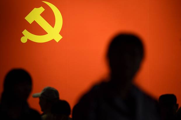 A party flag of the Chinese Communist Party is displayed at an exhibition showcasing China's progress in the past five years at the Beijing Exhibition Center.
