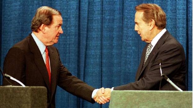 Republican presidential candidate Pat Buchanan (left) shakes hands with rival candidate and U.S. Senate Majority Leader Bob Dole at the start of a debate in Columbia, South Carolina, ahead of the primary in that state in 1996.