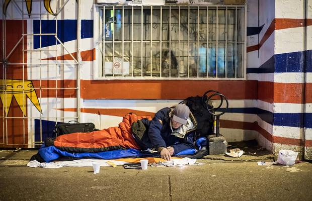 Richie Carter prepares his drugs on East Hastings Street, not far from Insite.
