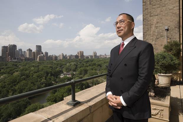 Guo Wengui, a Chinese billionaire involved in a public feud with a business rival, stands on the terrace of his Manhattan apartment.