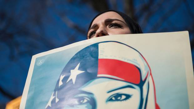 Isra C., of Washington, D.C., who did not want to give her last name, takes part in a protest outside the White House on Feb. 4, 2017.