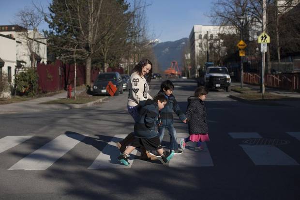 Marie Purdy makes her way to the park with her sister's orphaned sons, Lilman Purdy, 4, far left, and Loren Purdy, 6, second from right, along with her daughter Shirley, 6, far right.
